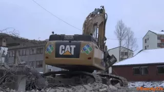 CAT 349E Excavator Demolishing Building