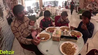 Nomadic family going to the city and father shopping for his children