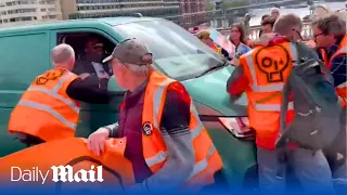 Van driver ploughs through Just Stop Oil protesters in London