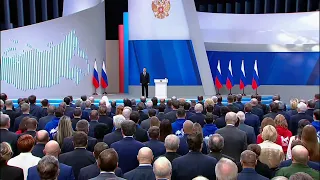 Putin addresses a gathering of both houses of parliament