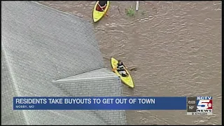 Mosby, MO residents take buyouts to get out of town after flooding