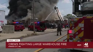 Firefighters battle 4-alarm warehouse fire which injured 7 firefighters