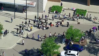 Protesters march outside of Washtenaw County court after arrests