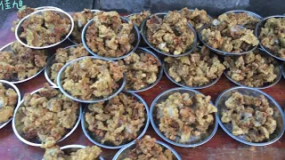 Chef is preparing food for a wedding banquet in rural China