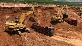 Caterpillar 345C And 245 Excavators Loading Mercedes And Man Trucks