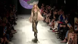 Gigi Hadid loses her shoe while on the runway for the Anna Sui Fashion Show