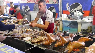 Italy Street Food. Roasting Piglets, Pork Ribs & Lots of Mixed Meat on Grill