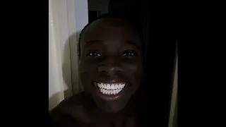 Smiling in dark laughing