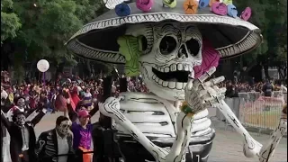 Towering skeletons join dancers at Mexico City's Day of the Dead parade