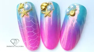 Mermaid inspired nails. 🧜‍♀️ Turquoise and purple ombre with Angel chrome and shell nail art.