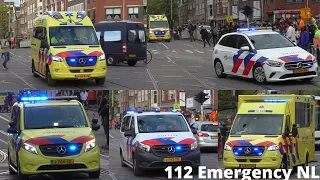 Ambulances en Politie met spoed door de drukke straten van Amsterdam tijdens Koningsdag 2022