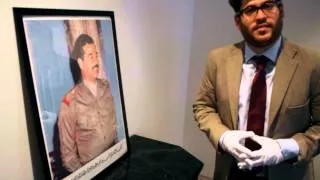 Episode 1. Saddam Hussein poster & pins.