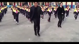 School Principal Leads Students Shuffle Dance During Recess