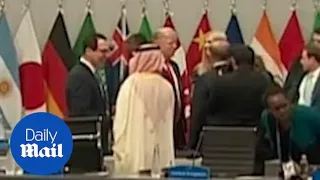 Mnuchin and Trump greet officials on the first day of G20 summit