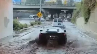 Driving a Lamborghini through a massive puddle