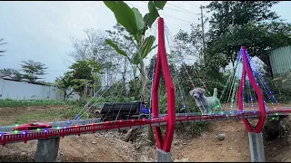 Construction of a mini cable-stayed bridge over land