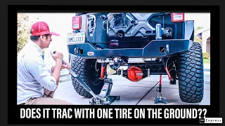 Eaton Truetrac with one wheel in the air demo. How to get traction with one tire on the ground.