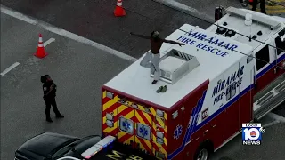 Police detain man who climbed fire rescue truck in Miramar