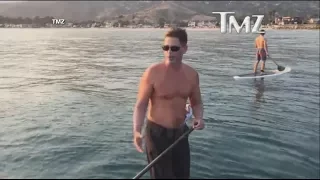 Rob Lowe paddleboards with great white sharks