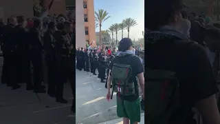 Protesters clash LAPD outside Pomona College Graduation