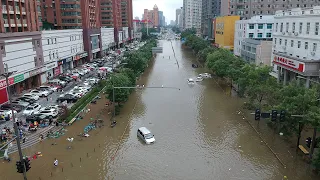 China floods: Drone footage shows extent of damage in Henan province