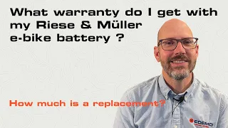 What warranty do I get with my Riese & Müller e-bike battery, and how much is a replacement?