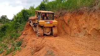 Caterpillar D6R XL bulldozer operator is very good at working to widen plantation roads With High