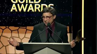 Lowell Ganz & Babaloo Mandel receive the Writers Guild Screen Laurel Award from Ron Howard