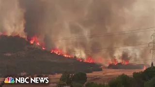 Wildfires scorch Greek countryside amid record temperatures in Europe