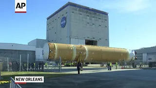 Core stage of NASA rocket rolls out to river