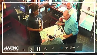 Panthers owner David Tepper removes man's hat at Charlotte bar