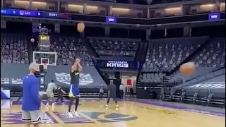 Steph curry shooting from the logo during practice