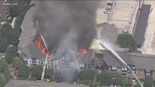 Firefighter hurt at scene of massive apartment fire in Atlanta