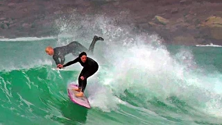 Surfing at Sennen Cove in Cornwall UK