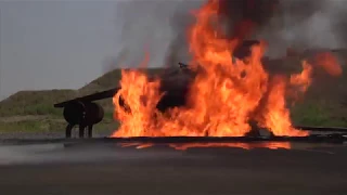 Aircraft Rescue and Firefighting Marines train with static water and live fire