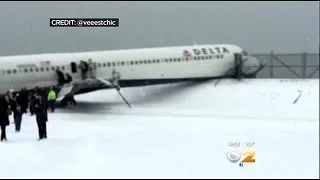 Plane Skids On Snowy Runway At LGA
