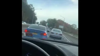 bmw and challenger weaving through traffic.