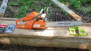 Husqvarna 455 rancher with 20 inch blade, ripping timber, with the timber tuff jig.