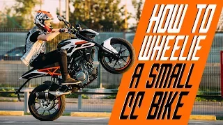 How to wheelie a small cc bike | RokON VLOG #25