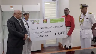 Fijian Prime Minister receives cheque donation from RFMF