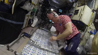 Work on the ISS - installation of protective curtains against radiation in a personal cabin.