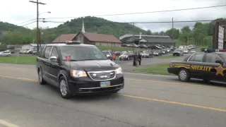 Six hearses leave Rhoden family funeral