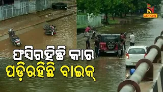 Car, Bike Get Stuck On Waterlogged Road Near Iskcon Temple As Heavy Rainfall Lashes Bhubaneswar