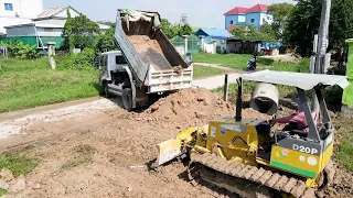 Full Action Showing Processing Mighty Dozer pushing Soil Filling Land / dump truck 5t dumping soil