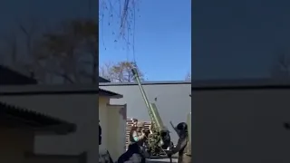 122-mm howitzer D-30 of the Crimean Battalion is firing from the courtyard in Ukraine
