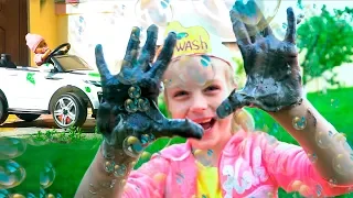 Margo playing Car Wash with Cleaning Toys