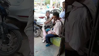 ear cleaning in Road side ..