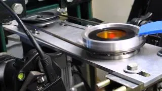 Beam shaping optics - eccentric spinner