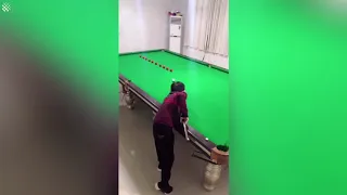 Talented boy shows off incredible pool trick shots.