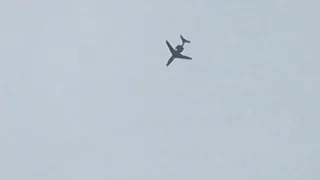 Embraer Phenom 300 flying overhead